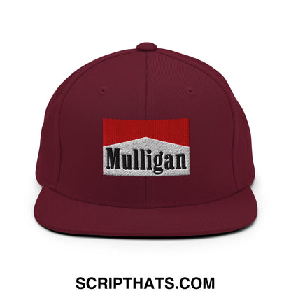 Maroon snapback hat with flat bill brim featuring an embroidered marlboro style mulligan logo in black on white background