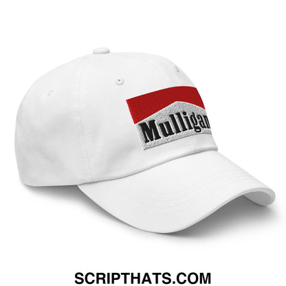 White unstructured golf dad hat with red embroidered mulligan logo and black text on textured gray background