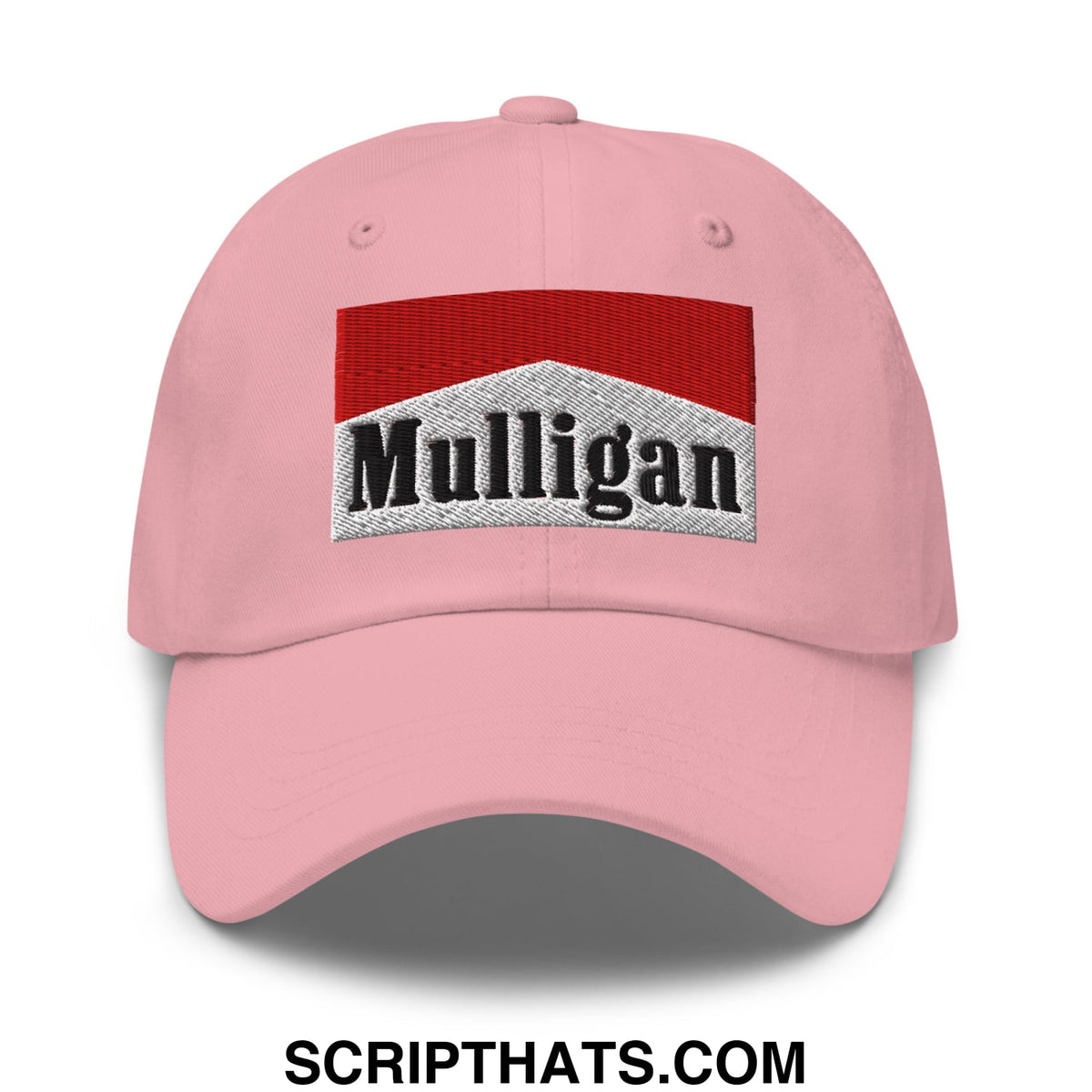 Pink unstructured golf dad hat featuring embroidered mulligan logo in red and silver with cigarette red accents