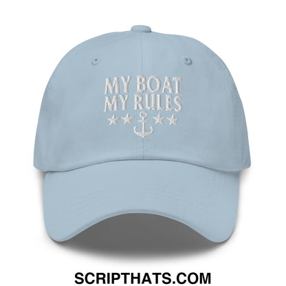 Light blue unstructured dad hat with white embroidered my boat my rules text and anchor design on front