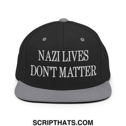 Black snapback cap with gray brim and button featuring white embroidered nazi lives don’t matter text
