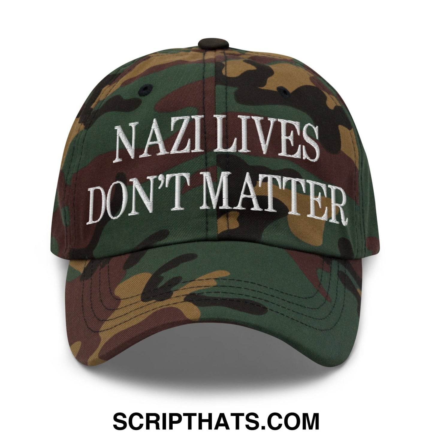 A camouflage-patterned unstructured dad hat with white embroidered text reading nazi lives don’t matter
