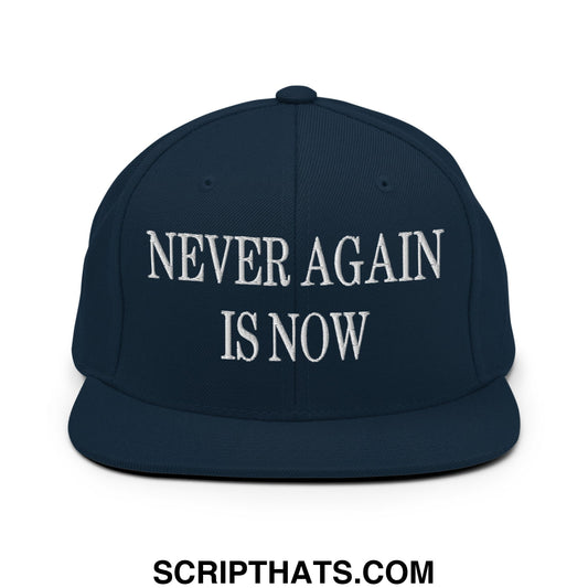 Navy blue snapback cap with flat bill brim and white embroidered text reading never again is now