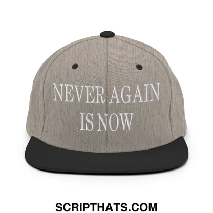 Gray snapback hat with black flat bill brim and white embroidered text never again is now for casual wear