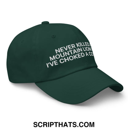 Dark green unstructured dad hat with white embroidered text never killed a mountain lion ive choked a cougar