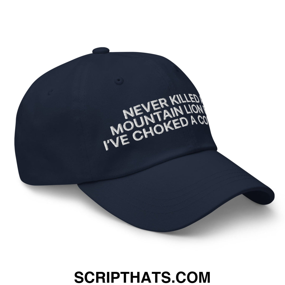 Navy blue unstructured dad hat with white embroidered text never killed a mountain lion ive choked a cougar