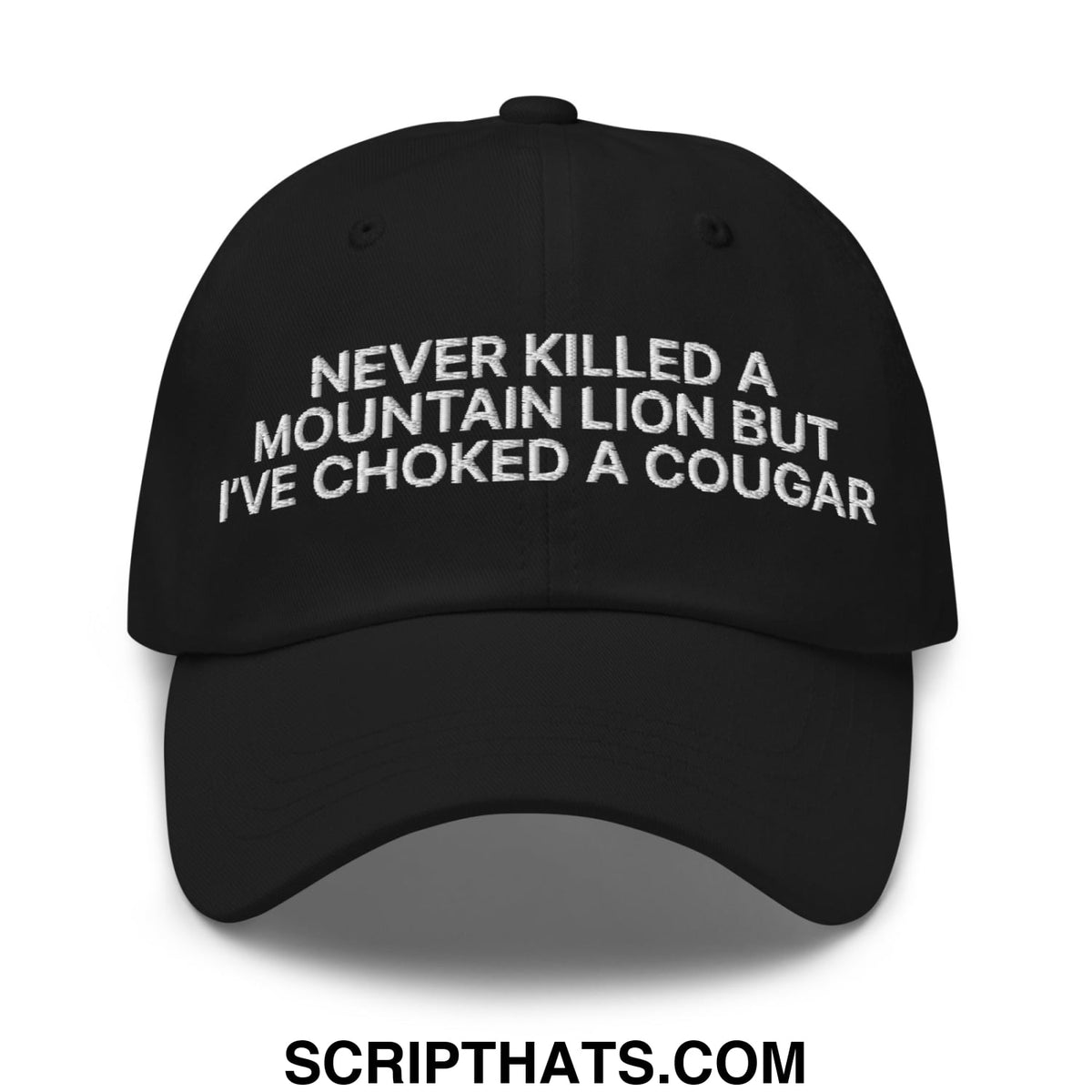 Black unstructured dad hat with white embroidered text never killed a mountain lion but ive choked a cougar