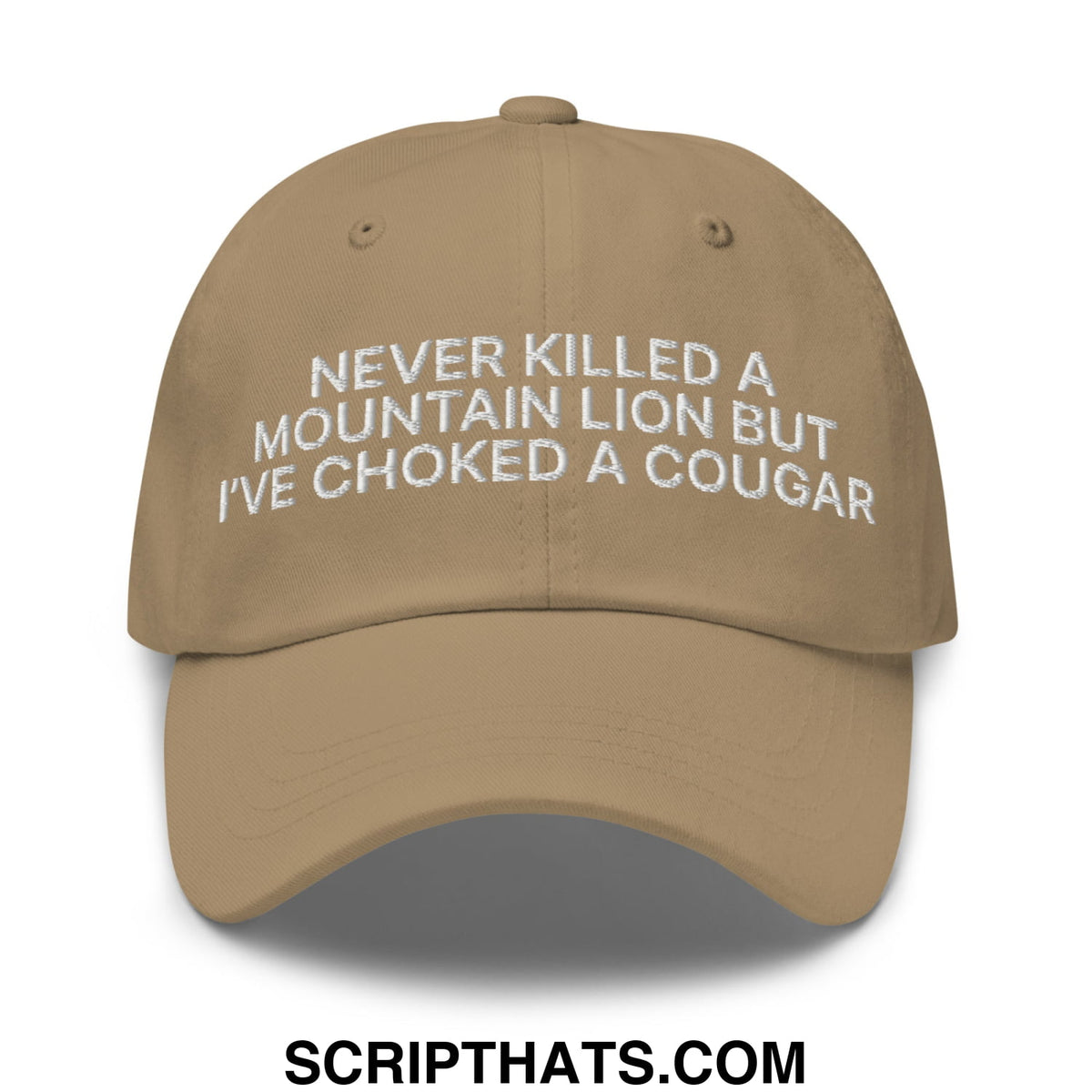 Tan embroidered unstructured dad hat with white text never killed a mountain lion but ive choked a cougar