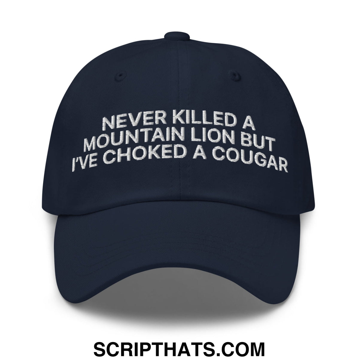 Navy blue unstructured dad hat with white embroidered text never killed a mountain lion but ive choked a cougar