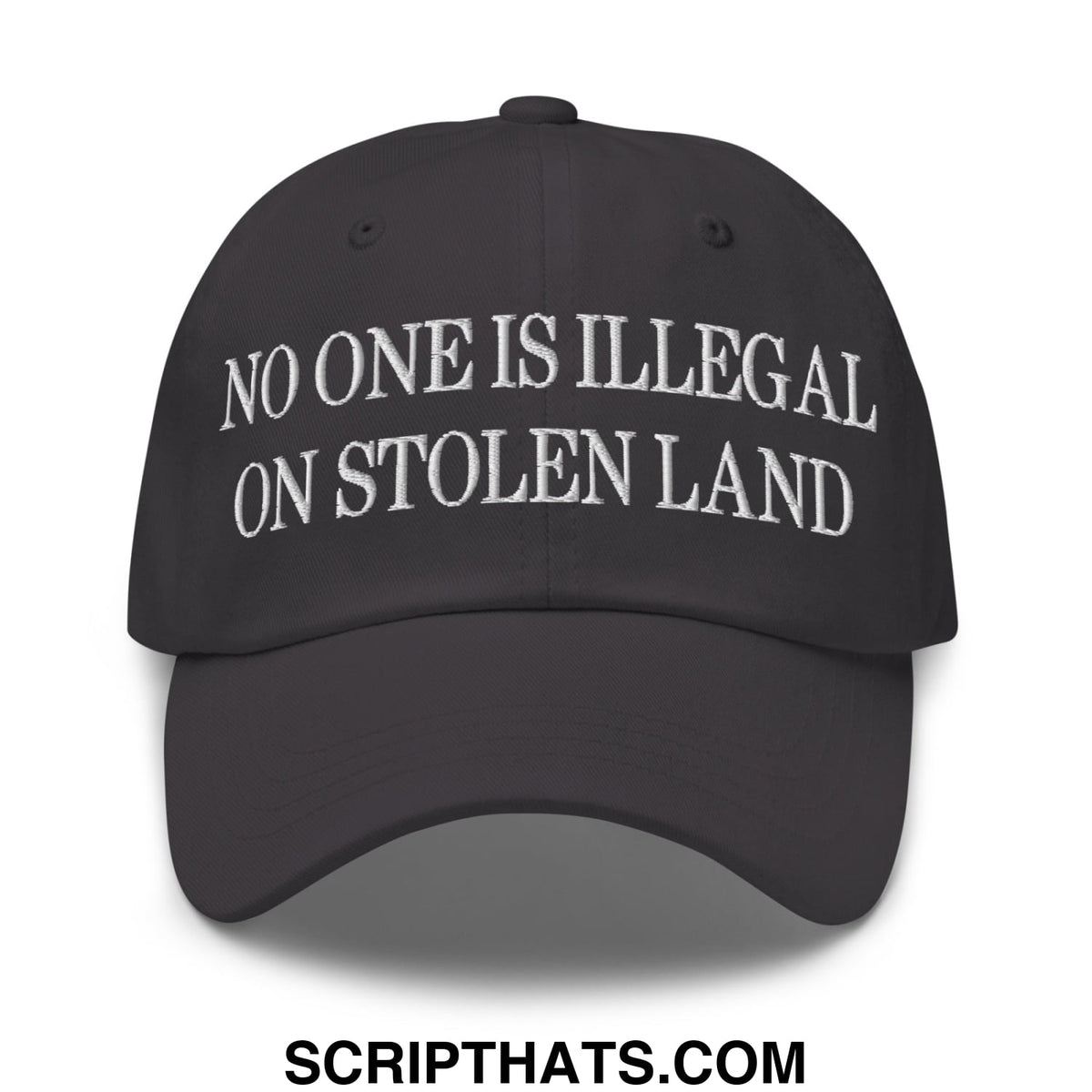 Black unstructured dad hat with white embroidered text no one is illegal on stolen land front view