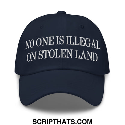 Navy blue unstructured dad hat with white embroidered text no one is illegal on stolen land for casual wear