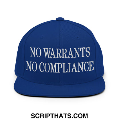 Royal blue snapback cap with white embroidered no warrants no compliance text and flat bill brim design
