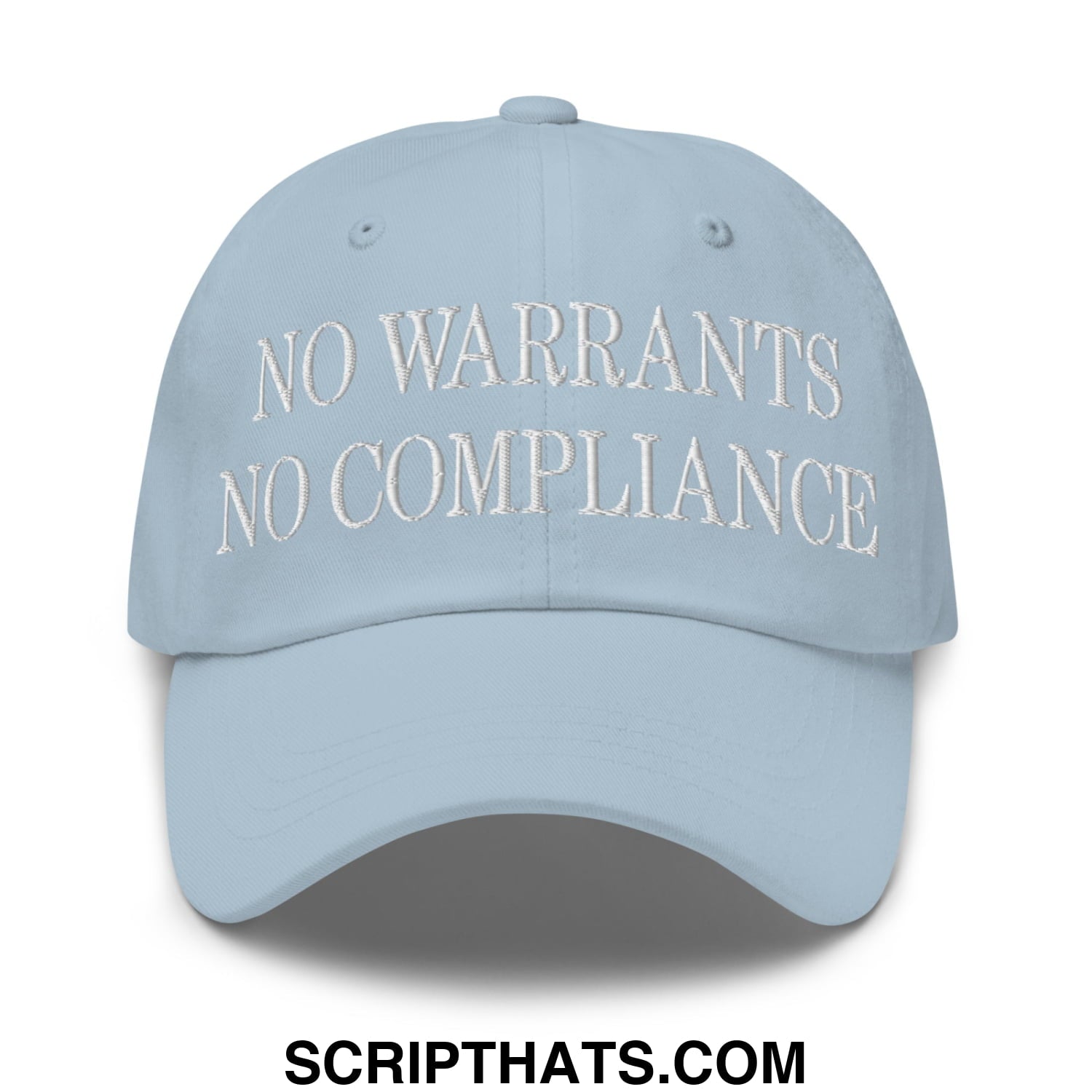 Light blue unstructured dad hat with white embroidered no warrants no compliance text front-facing design
