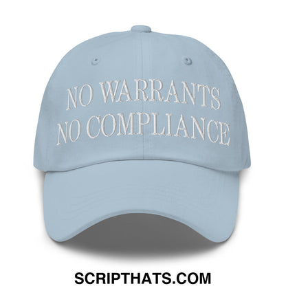 Light blue unstructured dad hat with white embroidered no warrants no compliance text front-facing design