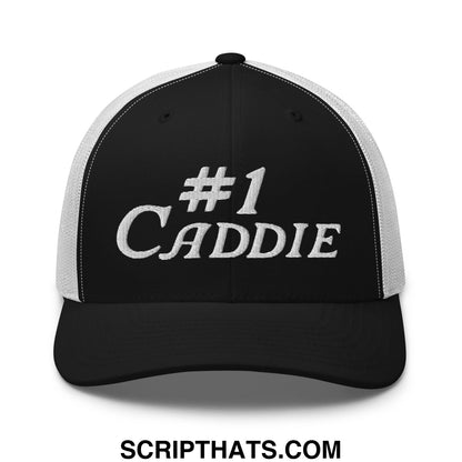 Black and white mesh trucker hat with number 1 caddie embroidered in silver thread on the front
