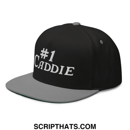 Black and gray snapback golf hat with white embroidered #1 caddie text and flat brim bill in 5 panel design
