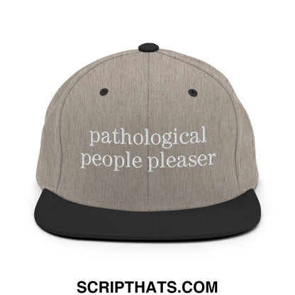 Gray and black snapback hat with white embroidered text reading pathological people pleaser on flat bill brim