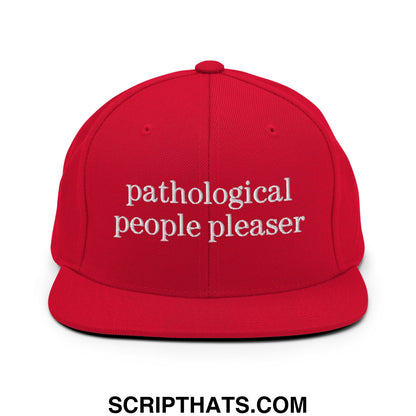Red snapback cap with white embroidered text reading pathological people pleaser flat bill brim snapback hat