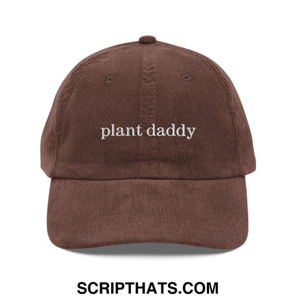 A brown corduroy unstructured baseball cap with plant daddy embroidered in white thread on the front