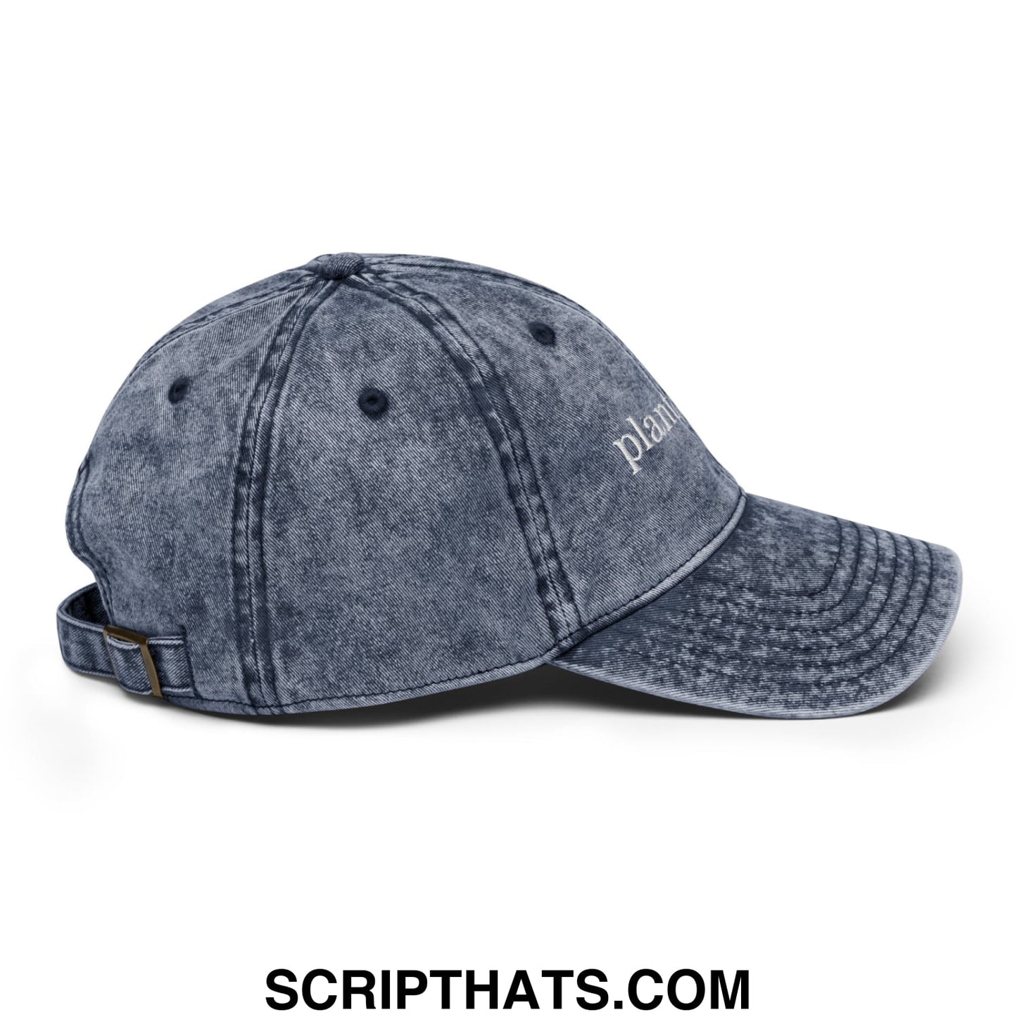 A faded blue denim dad hat with a subtle white embroidered plant daddy logo on the front panel
