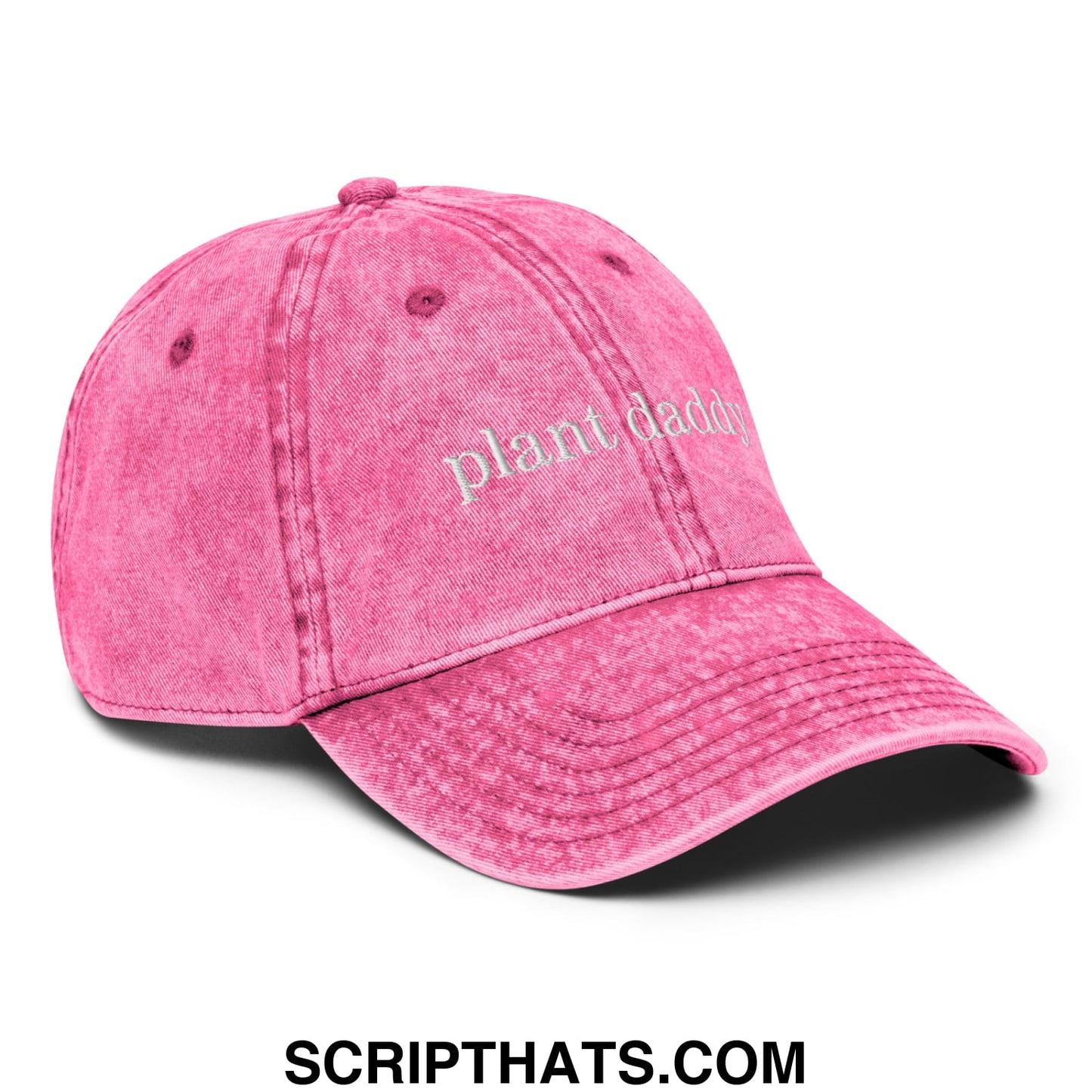 Faded pink denim dad hat featuring plant daddy embroidered in white thread on the front