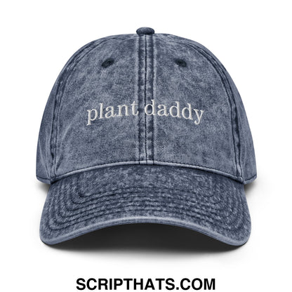 Faded blue denim unstructured dad hat with plant daddy embroidered in white script across the front
