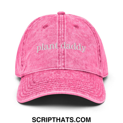 A vibrant pink distressed denim dad hat with plant daddy embroidered in light gray script on the front