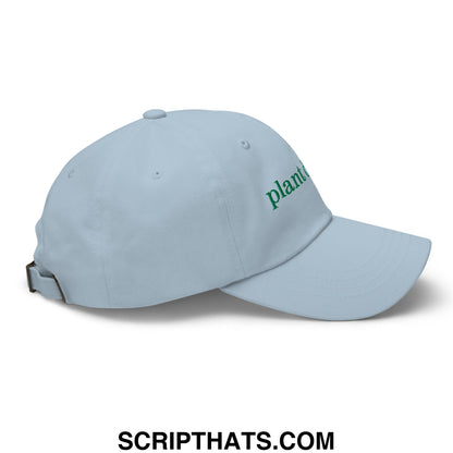 Light blue unstructured dad hat with green embroidered plant text on the side called Plant Daddy cap