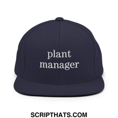 Navy blue snapback hat with white embroidered plant manager text and flat bill brim design