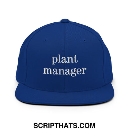 Royal blue snapback hat with flat bill and white embroidered plant manager text on the front panel