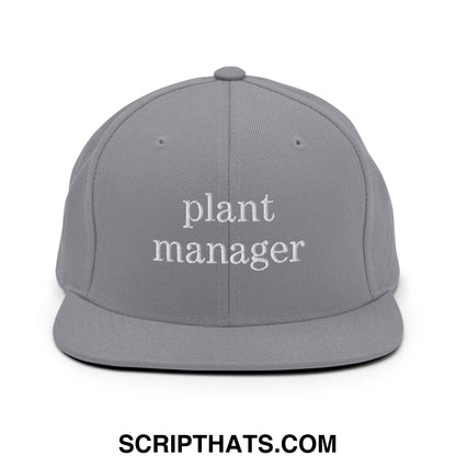 Gray snapback hat with plant manager embroidered in white thread on the front and flat bill brim design