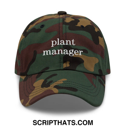 A camouflage unstructured dad hat with plant manager embroidered in white thread on the front panel