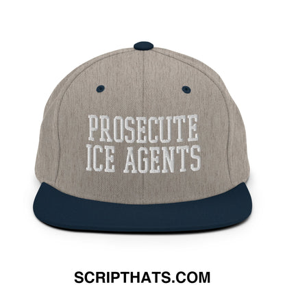 A beige and navy blue snapback hat with white embroidered proseute ice agents text across the front