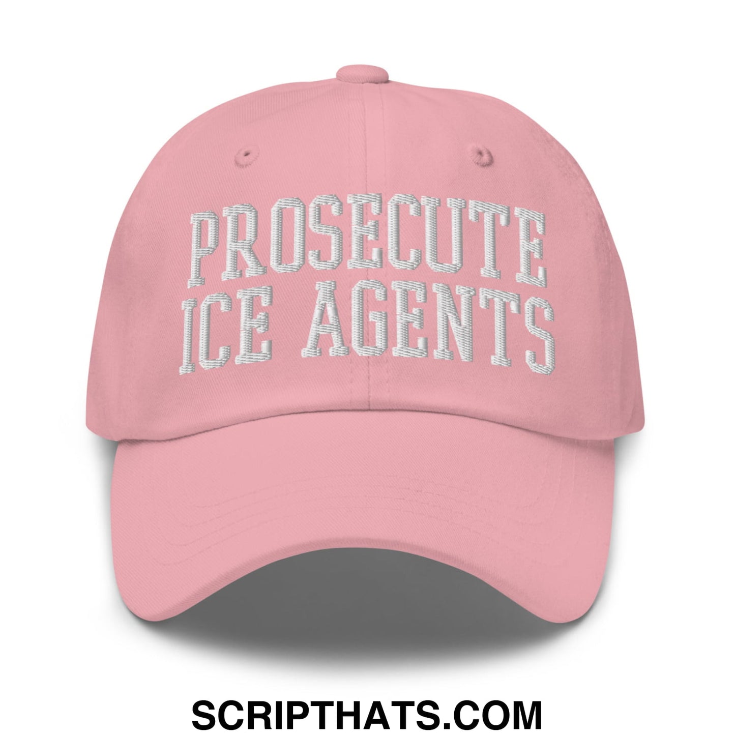 A soft pink unstructured dad hat with prosecute ice agents embroidered in white thread on the front