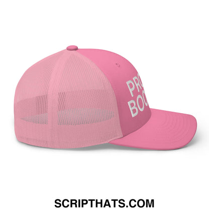 Pink mesh trucker hat with white embroidered proud boomer text on the side made of breathable material