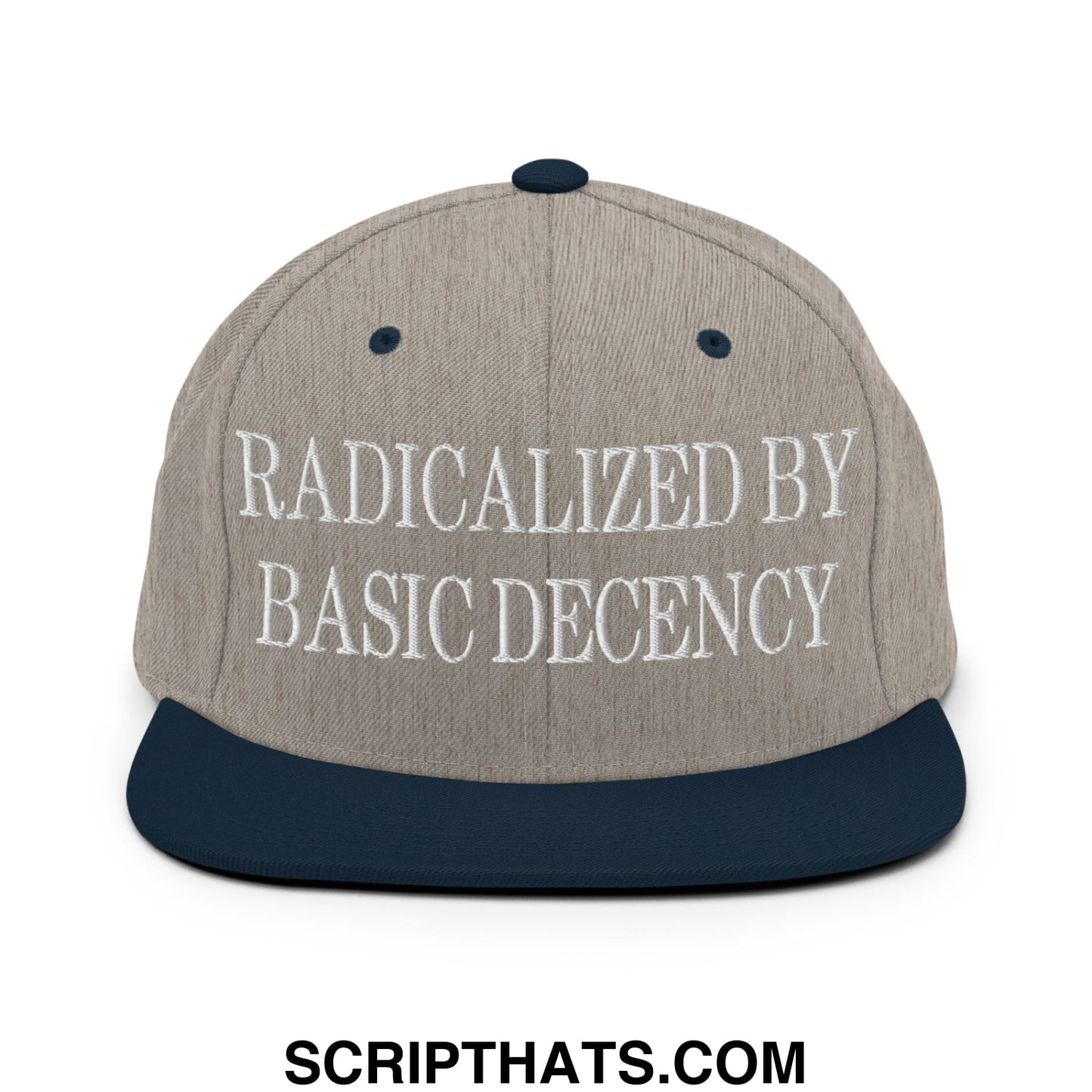 A beige and navy blue snapback hat with white embroidered text radicalized by basic decency on the front panel