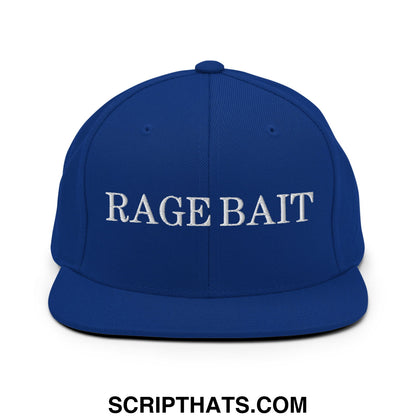 Royal blue snapback hat with white embroidered rage bait text and flat bill brim design