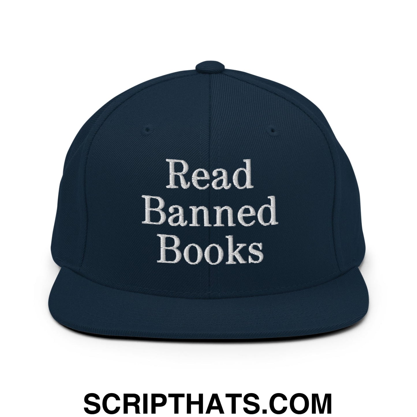 Navy blue snapback hat with white embroidered read banned books text and flat bill brim design