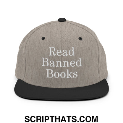 Gray snapback hat with black brim and embroidered white text read banned books flat bill brim design