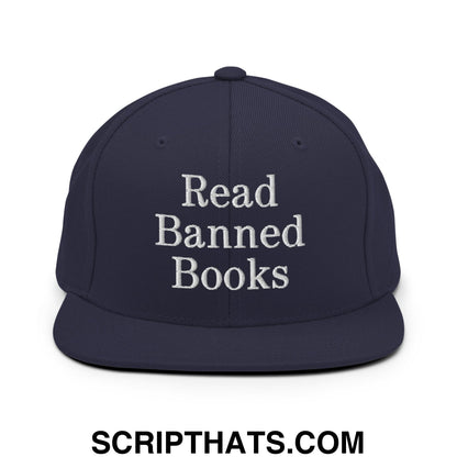 Navy blue snapback hat with white embroidered read banned books text and flat bill brim for casual wear