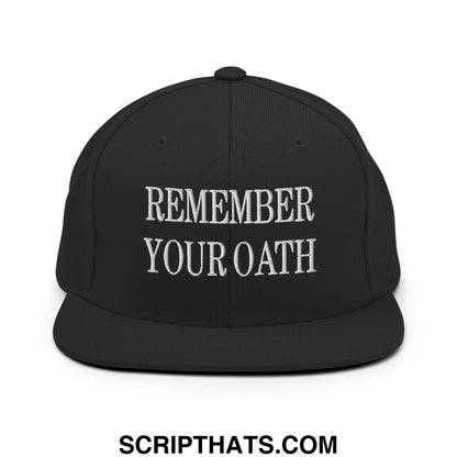 Black flat bill snapback hat with white embroidered remember your oath text in a bold streetwear style