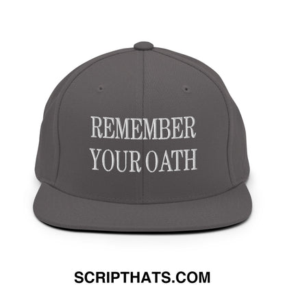 Gray snapback hat with white embroidered remember your oath text and flat bill brim for casual wear