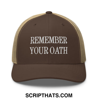 Brown and tan mesh trucker hat with white embroidered text remember your oath in a breathable design