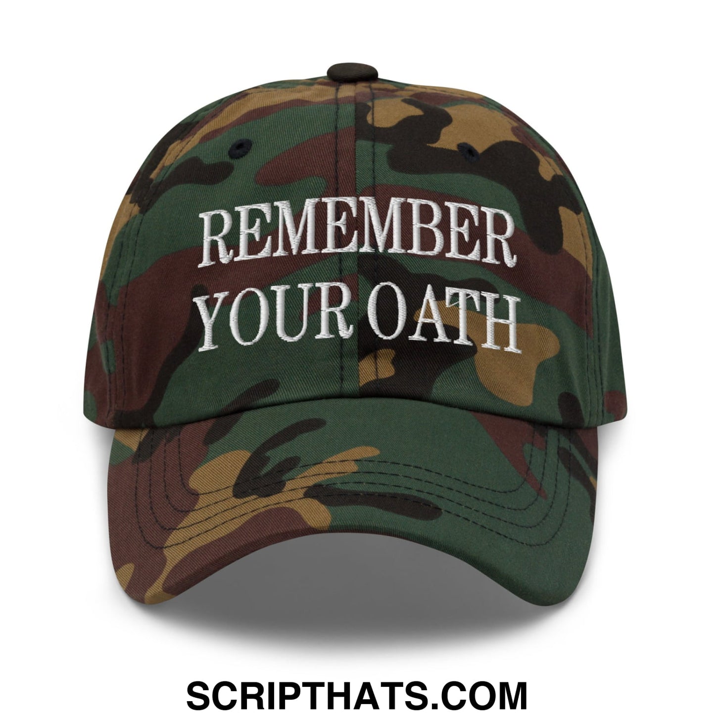 A camouflage unstructured dad hat with white embroidered text reading remember your oath on the front