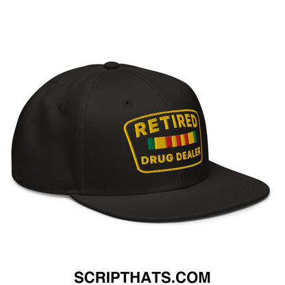 Black snapback cap with yellow embroidered retire drug dealer patch and green red yellow striped ribbons on front