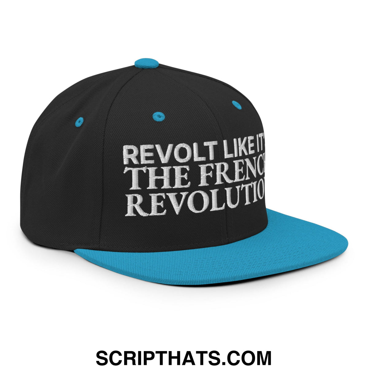 Black snapback cap with teal flat brim and button featuring white embroidered text revolt like it the french revolution