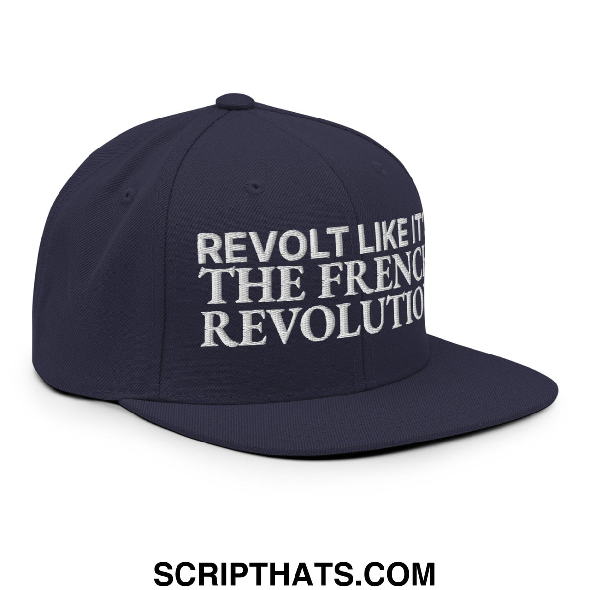 Navy blue snapback hat with white embroidered text reading revolt like it the french revolution on flat bill brim