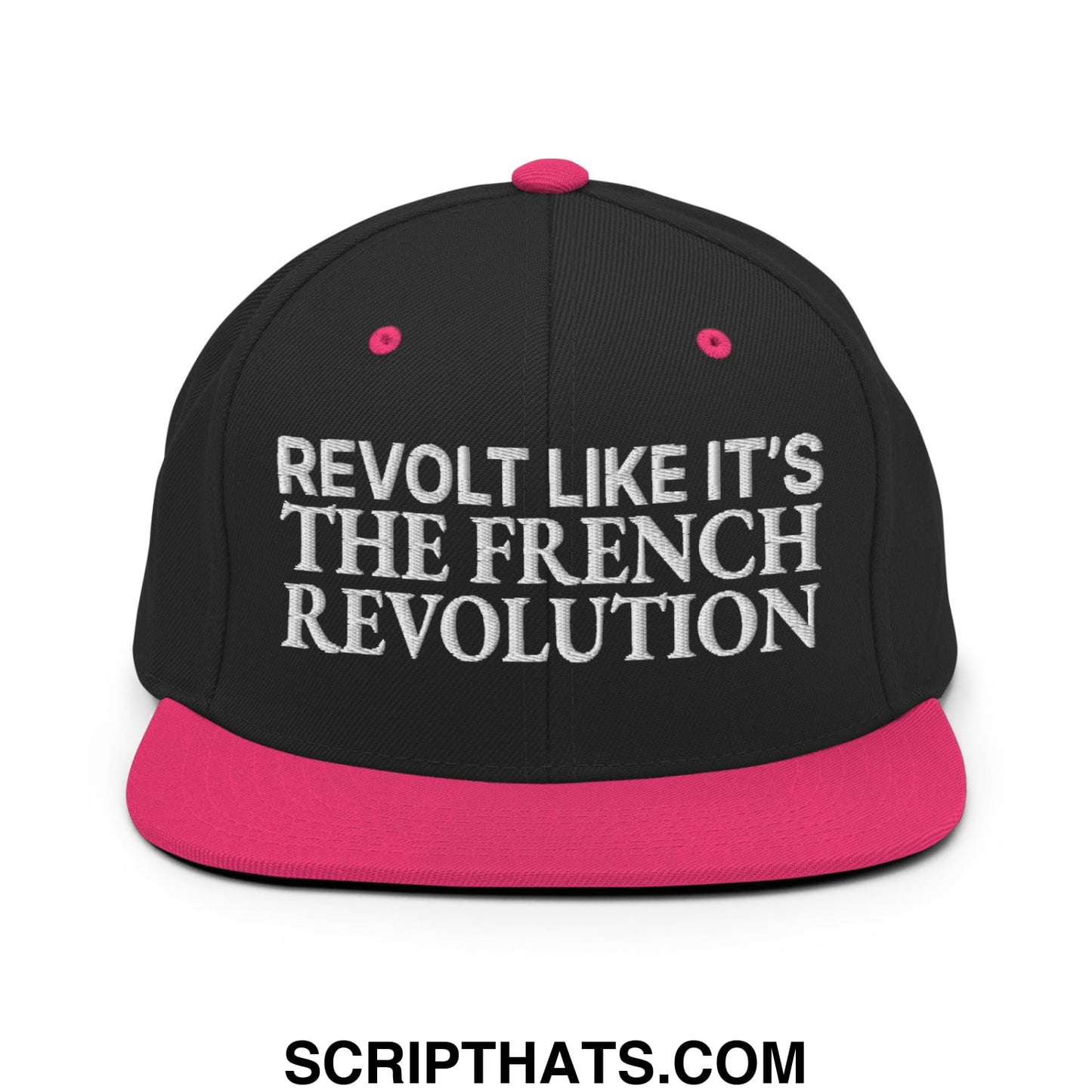 Black snapback cap with vibrant pink brim and button featuring white embroidered text revolt like it’s the french revolution