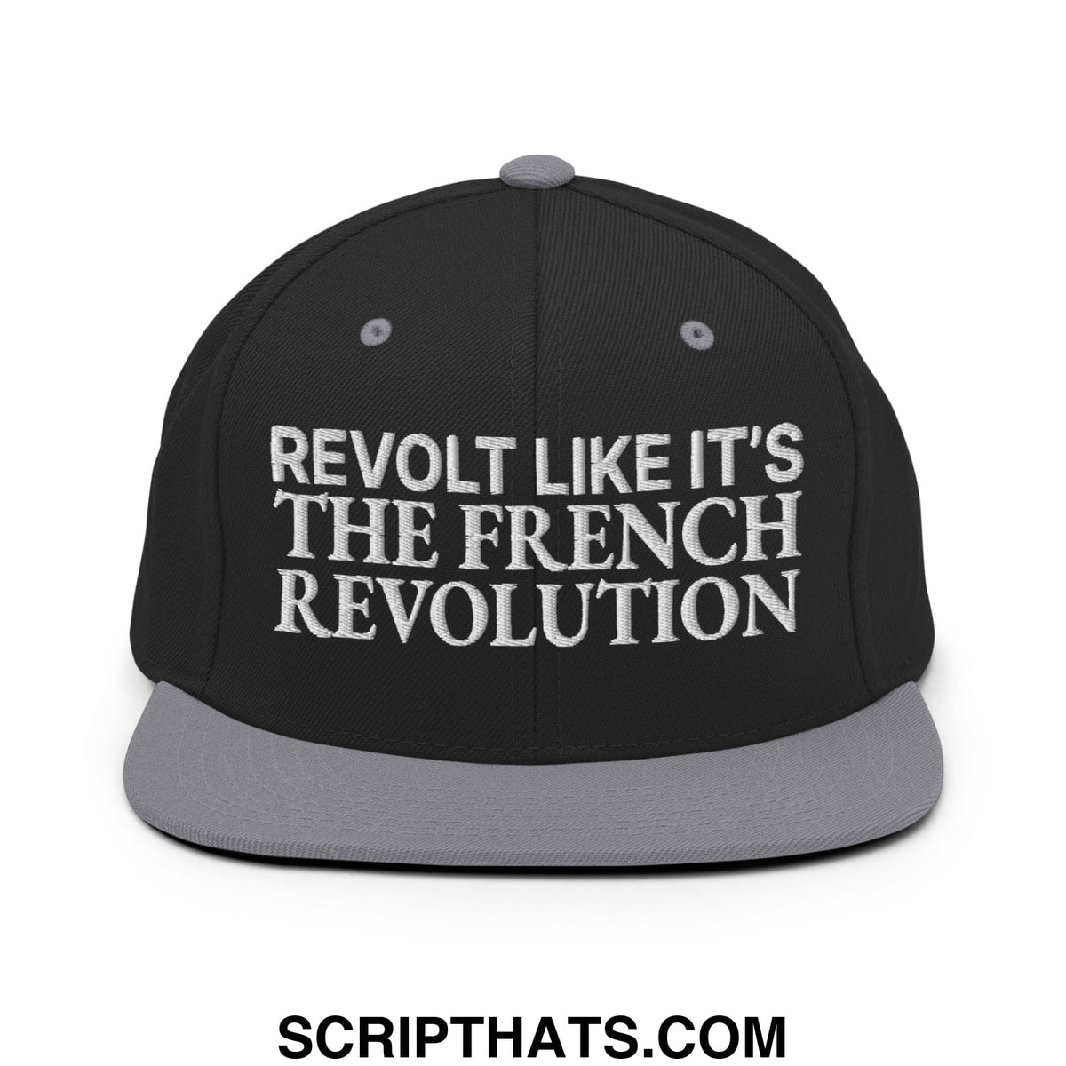 Black snapback hat with gray flat bill and white embroidered text reading revolt like it is the french revolution