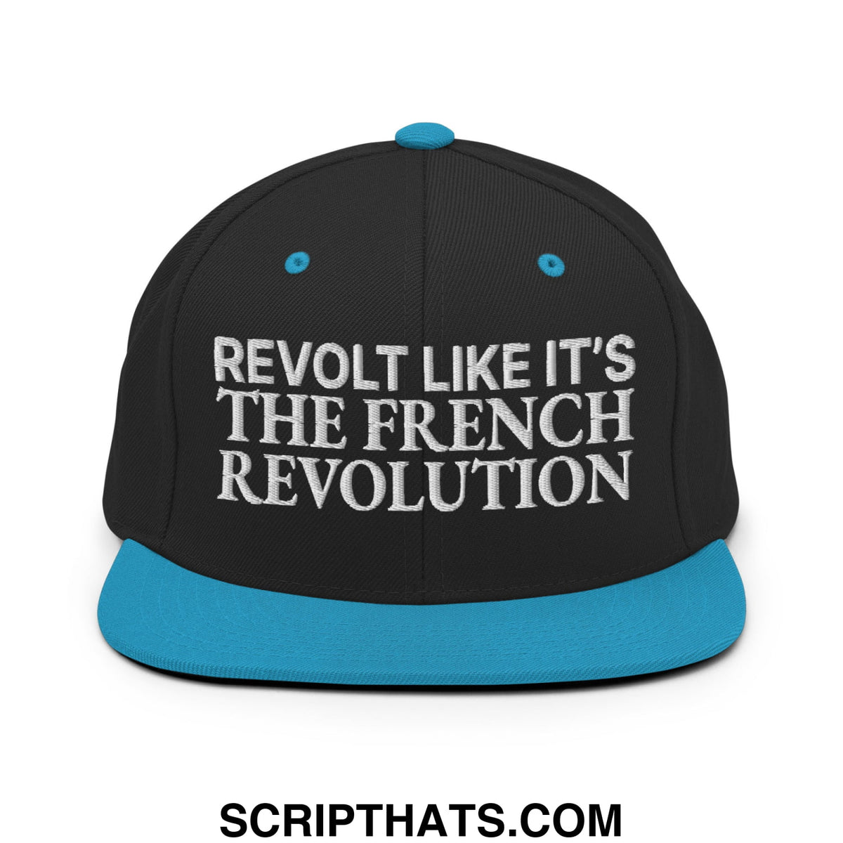 Black snapback cap with teal brim and button featuring white embroidered revolt like it’s the french revolution text